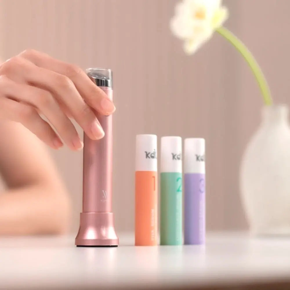 Pink KDL Serum Stick device displayed with Viva, Centellieve and Stempid serum refills.